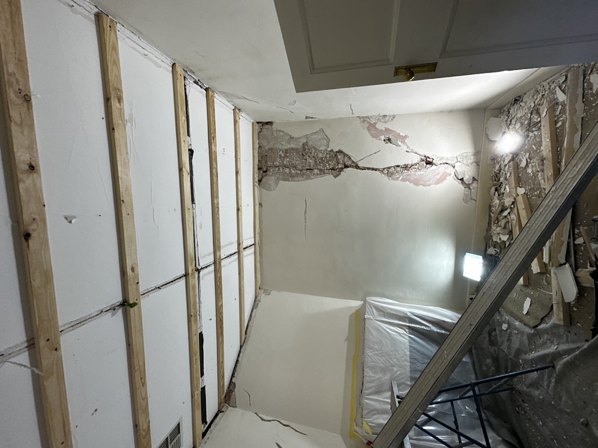 An old ceiling cracking and coming away.