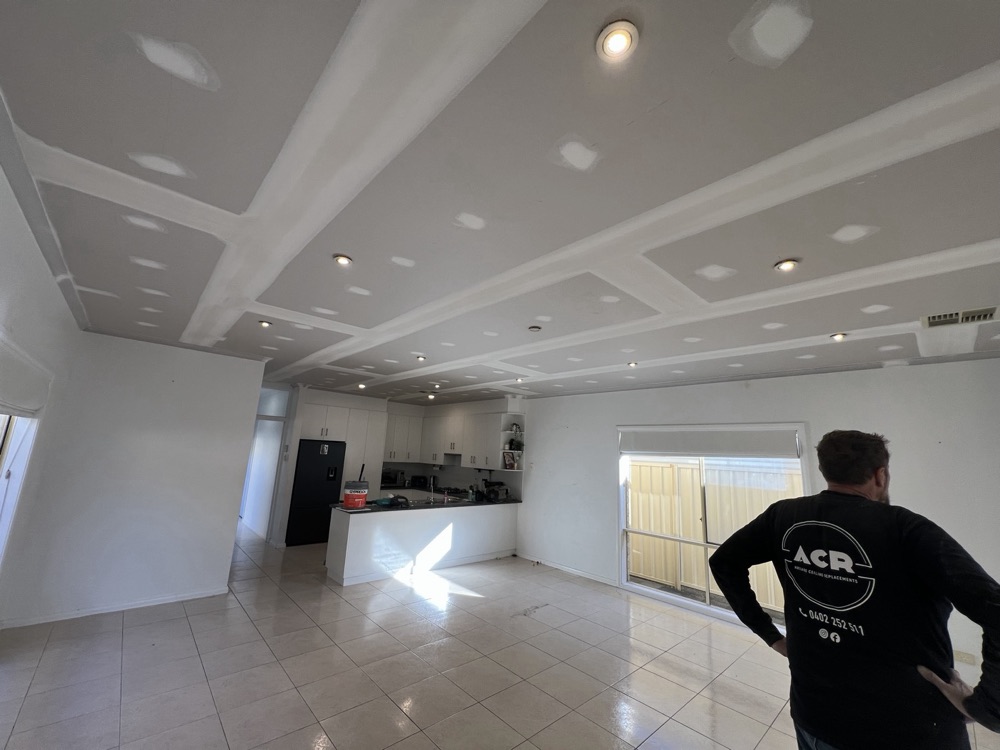 Open-plan kitchen and living, new ceiling flushed
