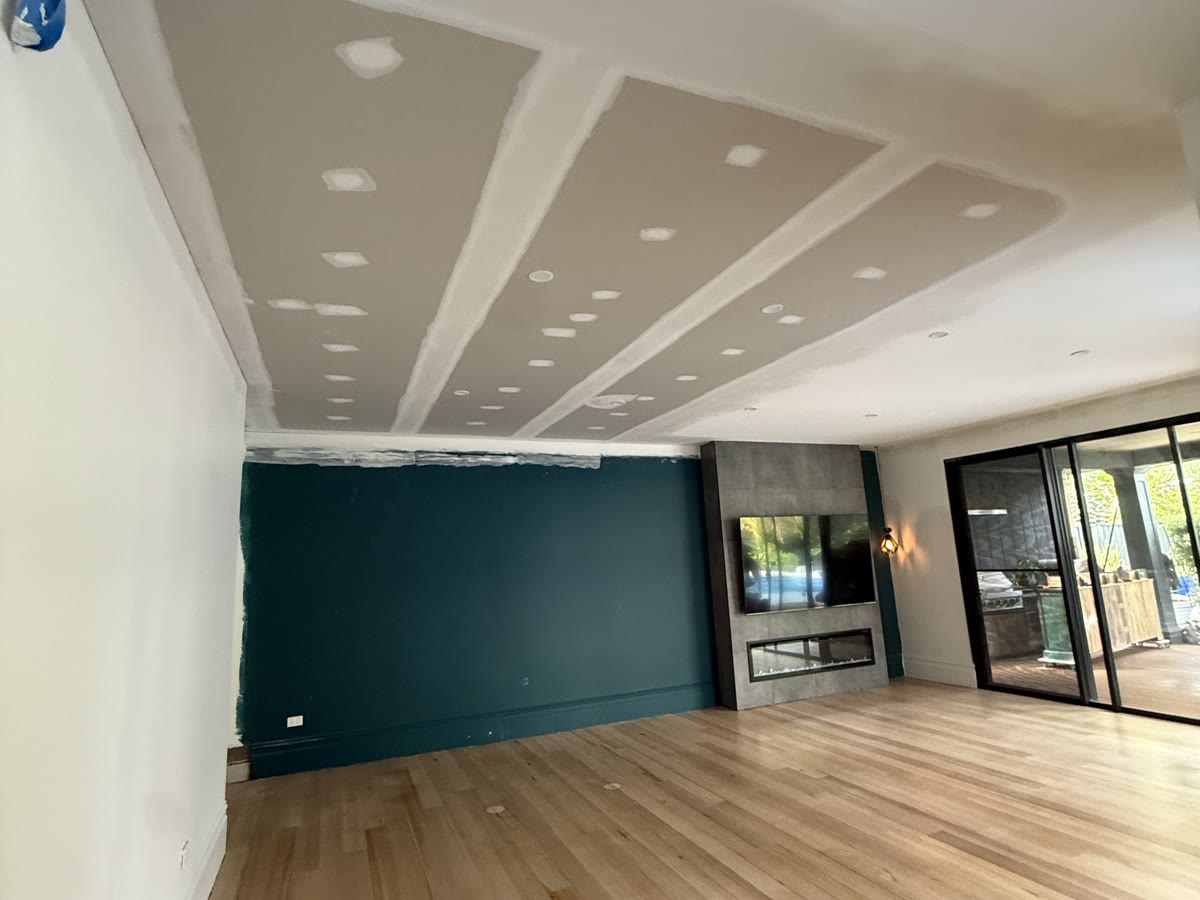 Living room with feature wall, new ceiling flushed