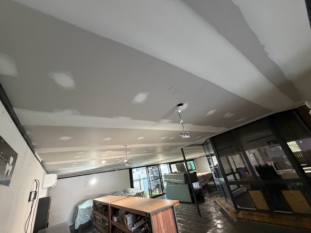 Open-plan living area, new ceiling flushed
